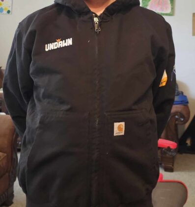Undawn Jacket Survival Kit | The Outerhaven Picture of the Coat included with the Undawn Survival Kit