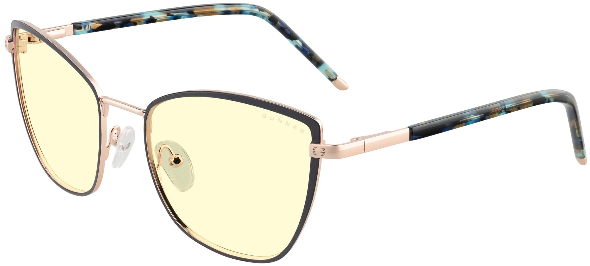 Erika Kista Collection | The Outerhaven The Erika glasses from the Kista collection. Cat eye angled with amber lenses and gold frames