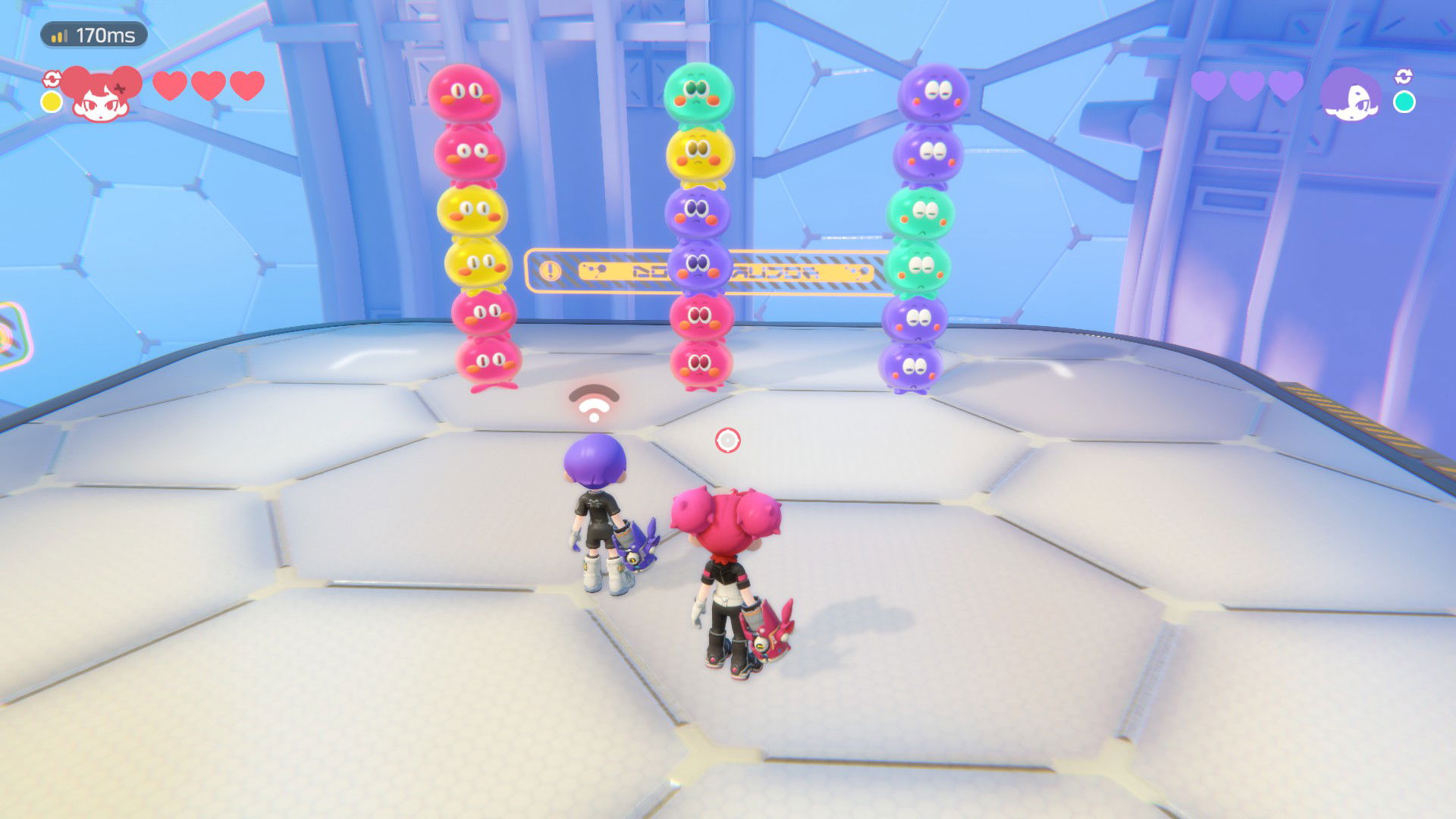 Screenshot of <em>Popucom</em> with two players looking at colored blobs