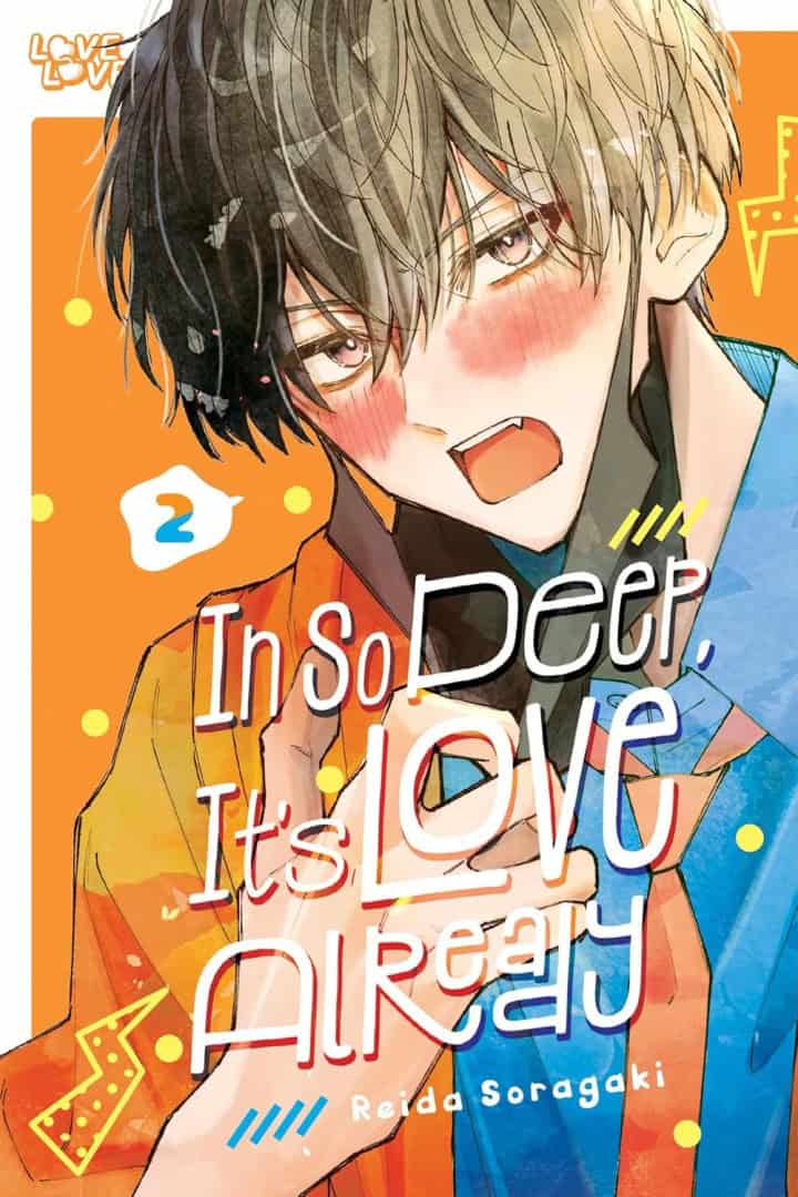 Close-up of a blushing anime boy with two-tone hair, wearing orange and blue clothing, on a bright background with the title'In So Deep It's Love Already'.