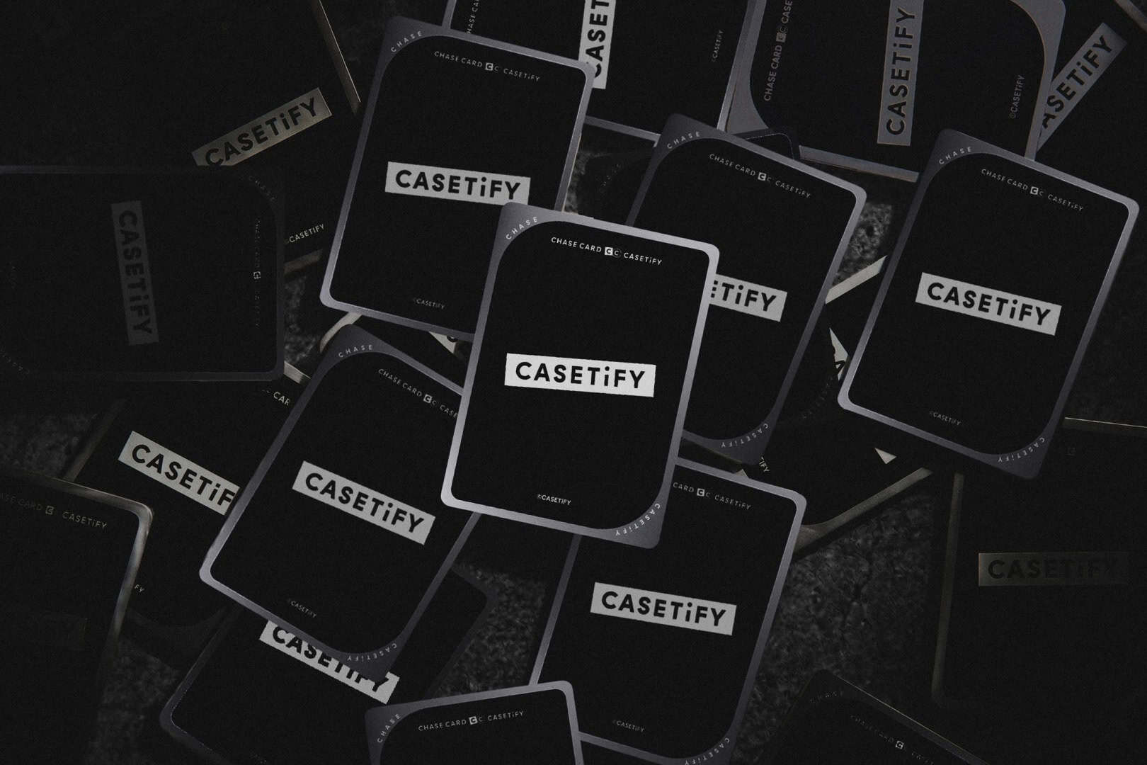 Casetify Cards 2 | The Outerhaven Collage of black Casetify brand cards scattered on a dark surface.