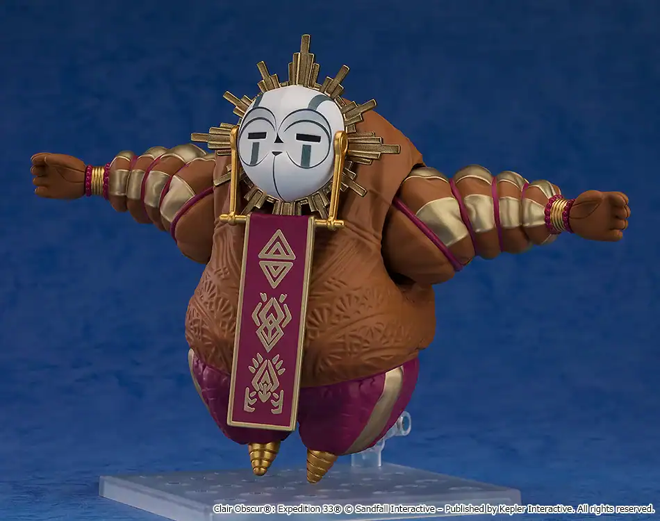 Plump brown-robed action figure with a gold sunburst crown and silver masked face, arms spread wide.