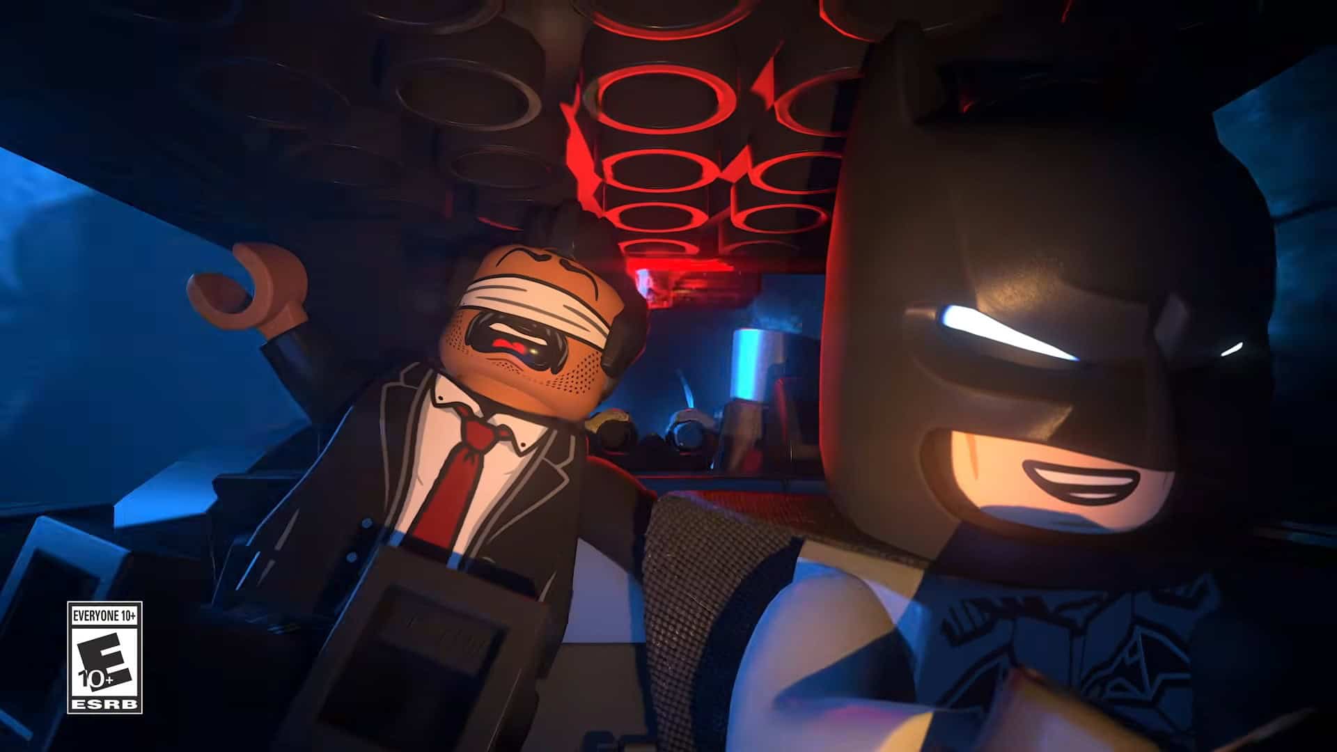LEGO® Batman™_ Legacy of the Dark Knight Official Launch Trailer 0-3 screenshot | The Outerhaven LEGO Batman and a suited minifigure in a dim, neon-lit vehicle interior with red circular ceiling lights.