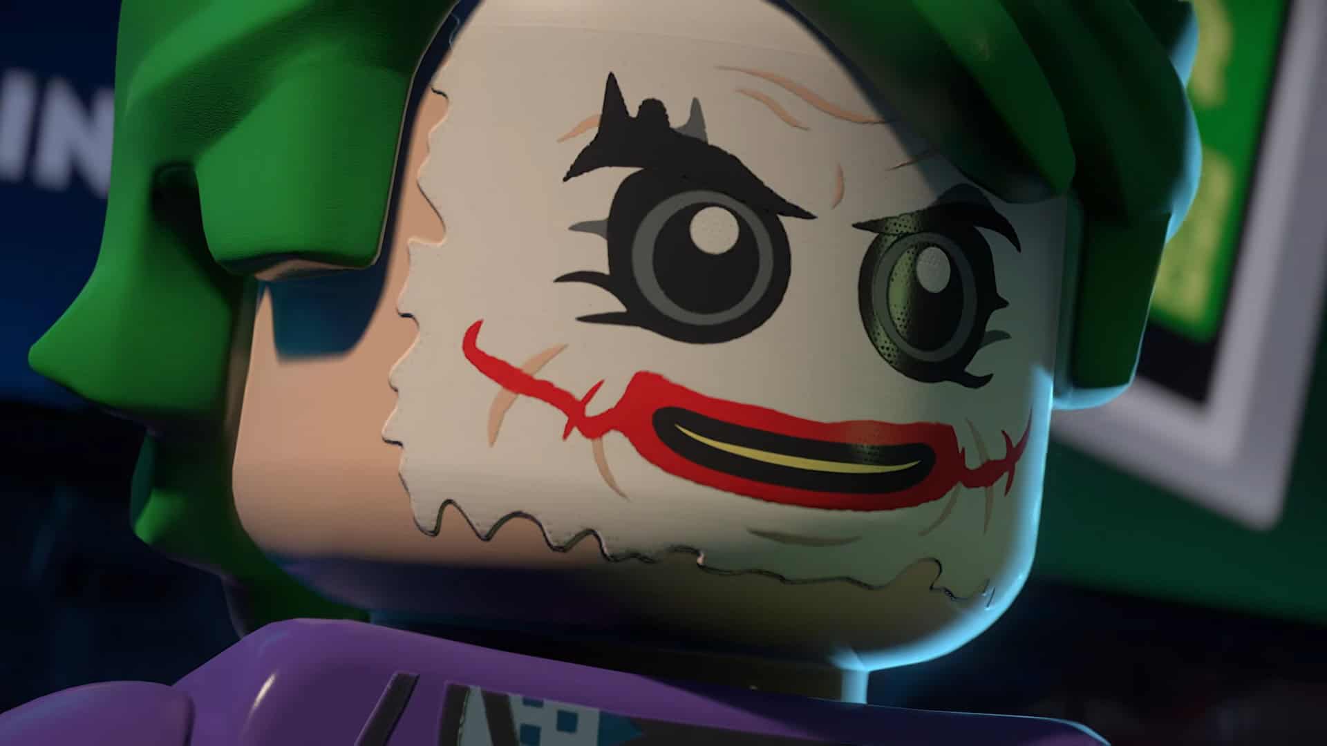 LEGO® Batman™_ Legacy of the Dark Knight Official Launch Trailer 0-44 screenshot | The Outerhaven Close-up of a LEGO Joker minifigure with green hair and a red grin on a pale face, purple outfit visible in the corner.