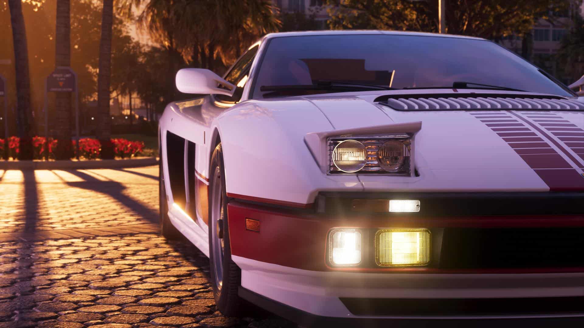 Grand-Theft-Auto-VI-Ulimate Edition-images 2 | The Outerhaven Front-left view of a white vintage sports car with a red racing stripe, parked on a sunlit cobblestone street at sunset.