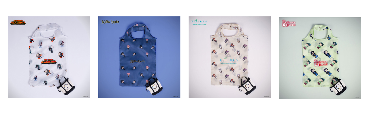 TOHO AE 3 | The Outerhaven White tote bag with a colorful character pattern on a pale gray background, small black-and-white pouch in the lower corner.