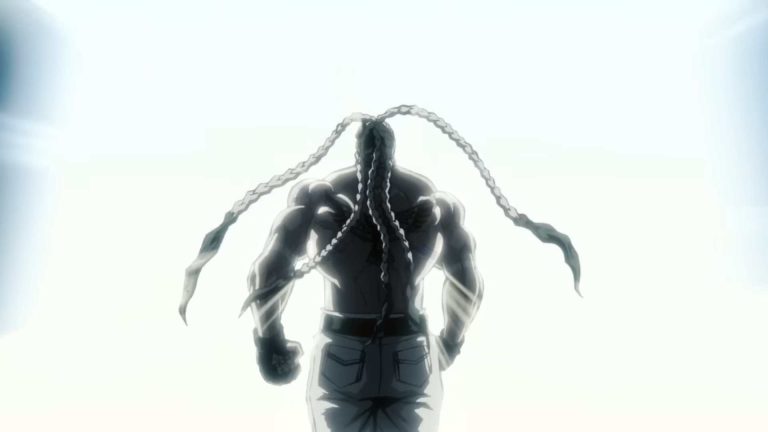 Back view of a muscular figure with braided chains draped over the shoulders, standing against a bright, washed-out background.