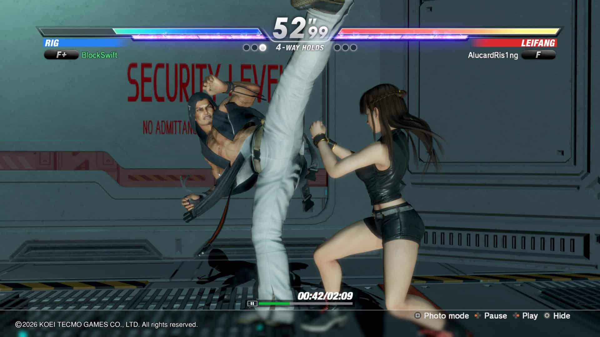 19f1dcf491b40-screenshotUrl | The Outerhaven Fighting game screenshot with two characters in mid-action, one delivering a high kick while the other falls; health bars and timer above, futuristic arena in background.