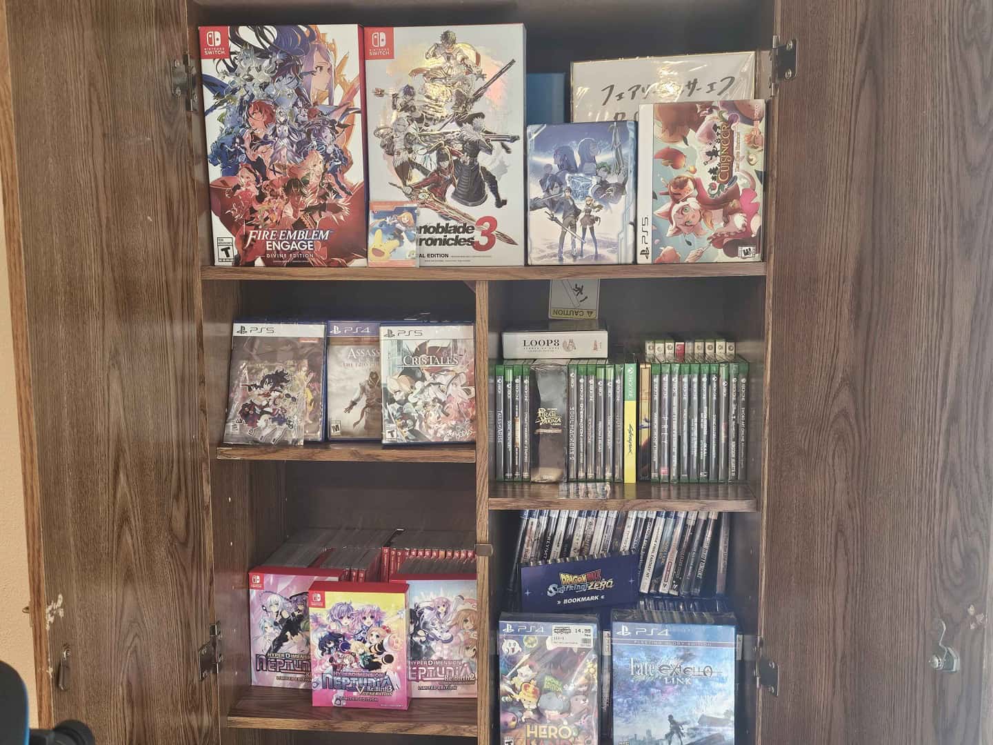 A picture of physical games in a cabinet from Scott's house