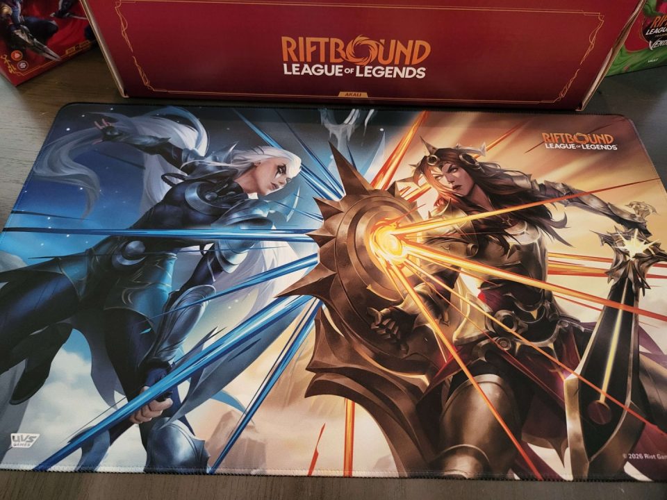 20260717_153547 | The Outerhaven Illustrated Riftbound artwork for League of Legends showing two armored female warriors facing off, with blue energy beams on the left and orange energy strikes on the right.