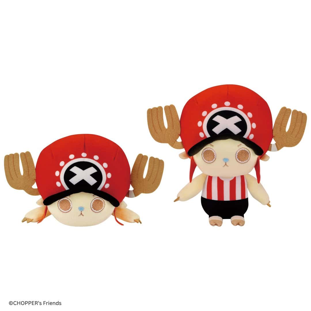 CHOPPER_s PLUSH CHOPPERROUND1 COLOR | The Outerhaven Two plush toy characters wearing red pirate hats with a white skull emblem; one lies on its belly, the other stands wearing a red-and-white striped shirt and black shorts.