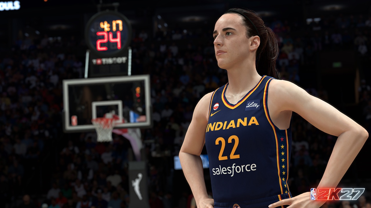 NBA 2K27 First Look Screenshots Caitlin Clark 1 Indiana basketball player wearing navy jersey with number 22 and 'salesforce' sponsor, standing with hands on hips on a court with a crowd in the background.