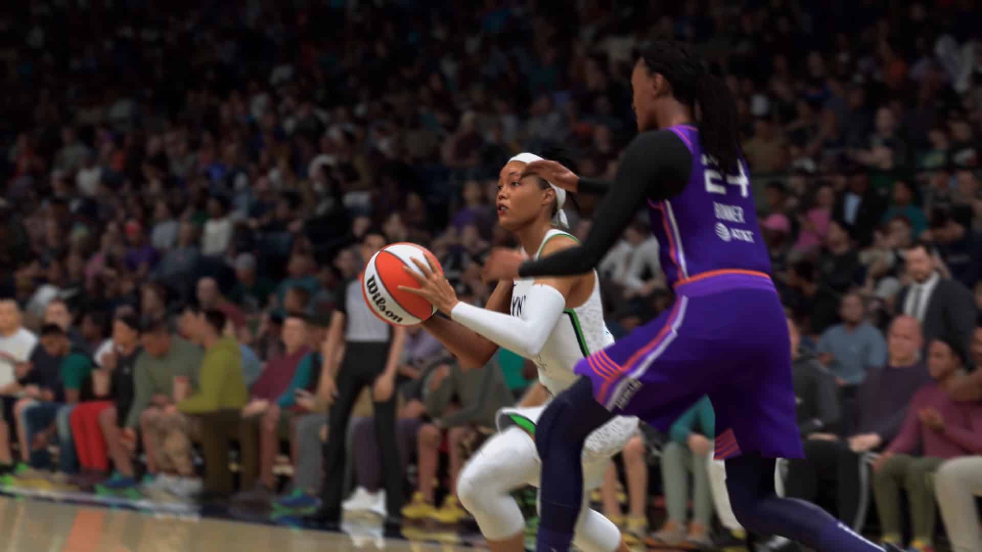 NBA 2K27_ Official Gameplay Trailer 1-5 screenshot Female basketball player in white drives with the ball while a purple-clad defender chases near a crowded arena audience.