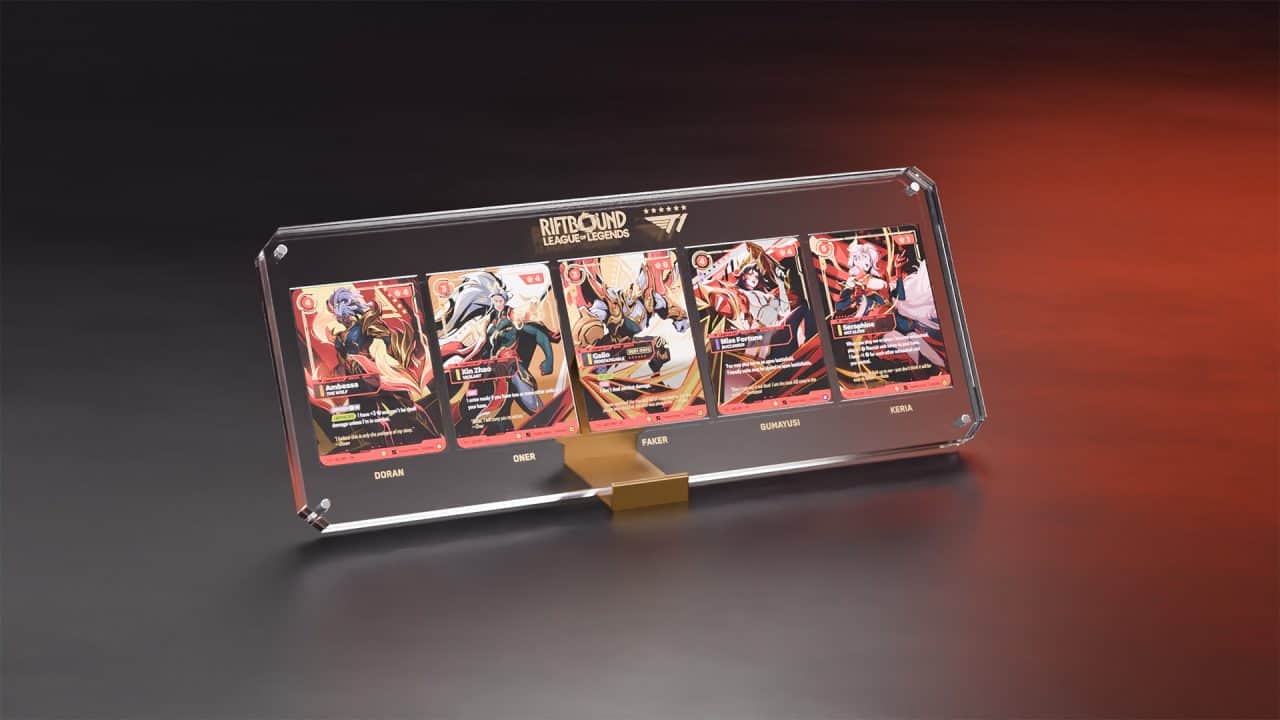 Riftbound x T1 2025 Worlds Champion Collection Display | The Outerhaven A glass display case showing five colorful trading cards from Riftbound: League of Legends, arranged in a row on a stand.