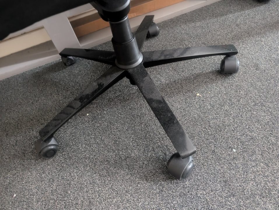 BAP Wheels | The Outerhaven Black office chair base with five caster wheels on a gray carpet.