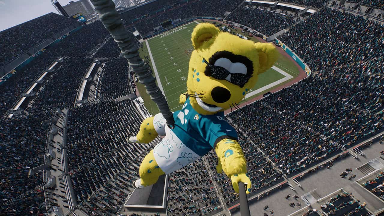 EA SPORTS™ Madden NFL 27Jags Masc Yellow mascot wearing sunglasses and a teal shirt zip-lining above a packed football stadium.
