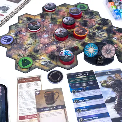 Elder Scrolls | The Outerhaven Tabletop board game in progress with hex tiling, colorful round tokens, and action cards laid out on a white table surface.
