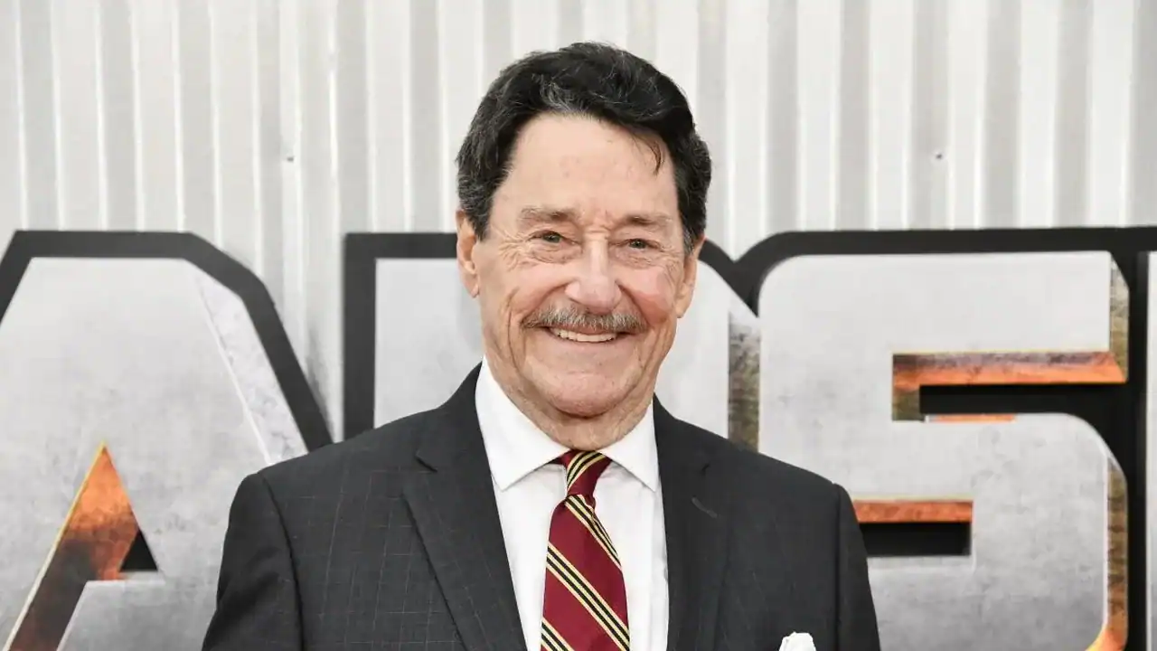 Peter Cullen standing in front of Transformer sign | The Outerhaven Peter Cullen standing in front of Transformer sign