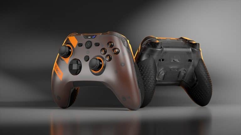 SCUF26-Nemesis-GTM-PK-1 1 | The Outerhaven Two SCUF gaming controllers with orange accents, viewed from the front and rear, resting on a reflective surface.