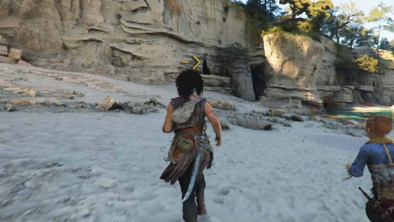 clue one | The Outerhaven Third-person view of a warrior running on a sandy beach toward a rocky cliff cave, with a second character behind him in a fantasy game setting.