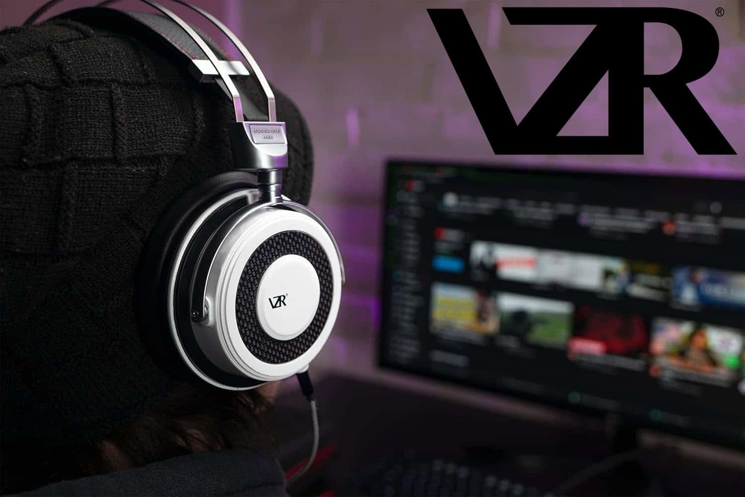 VZR Model One Mk II - 3 with LOGO | The Outerhaven VZR Audio logo over a man with the VZR Model One MKII gaming headset