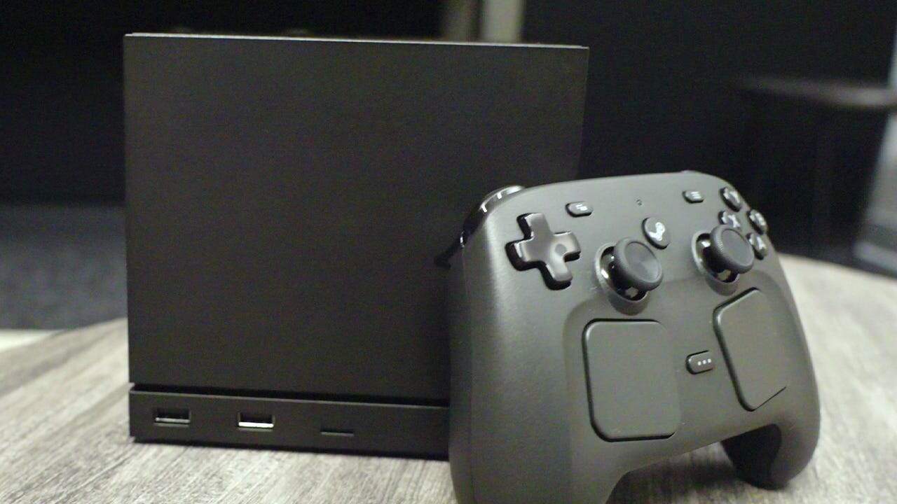 Image of Valve's Steam Machine sitting on a gray table. | The Outerhaven Steam Machine